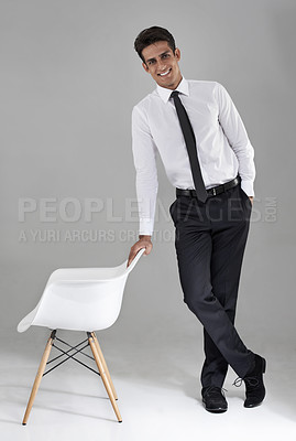 Buy stock photo Shirt, tie and portrait of businessman with chair in studio, grey background and mock up space. Confident, man and opportunity for worker to interview for a professional job with happiness and pride