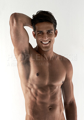 Buy stock photo Muscle, portrait and smile with man, abs and fitness isolated on a white studio background with wellness. Face, person and model with happiness, six pack or bodybuilder with joy, cheerful and healthy