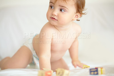 Buy stock photo Baby, building blocks and playing on bed, education and learning for child development in bedroom. Sensory, alphabet and english or letters, care and toys for growth, coordination and cognitive skill
