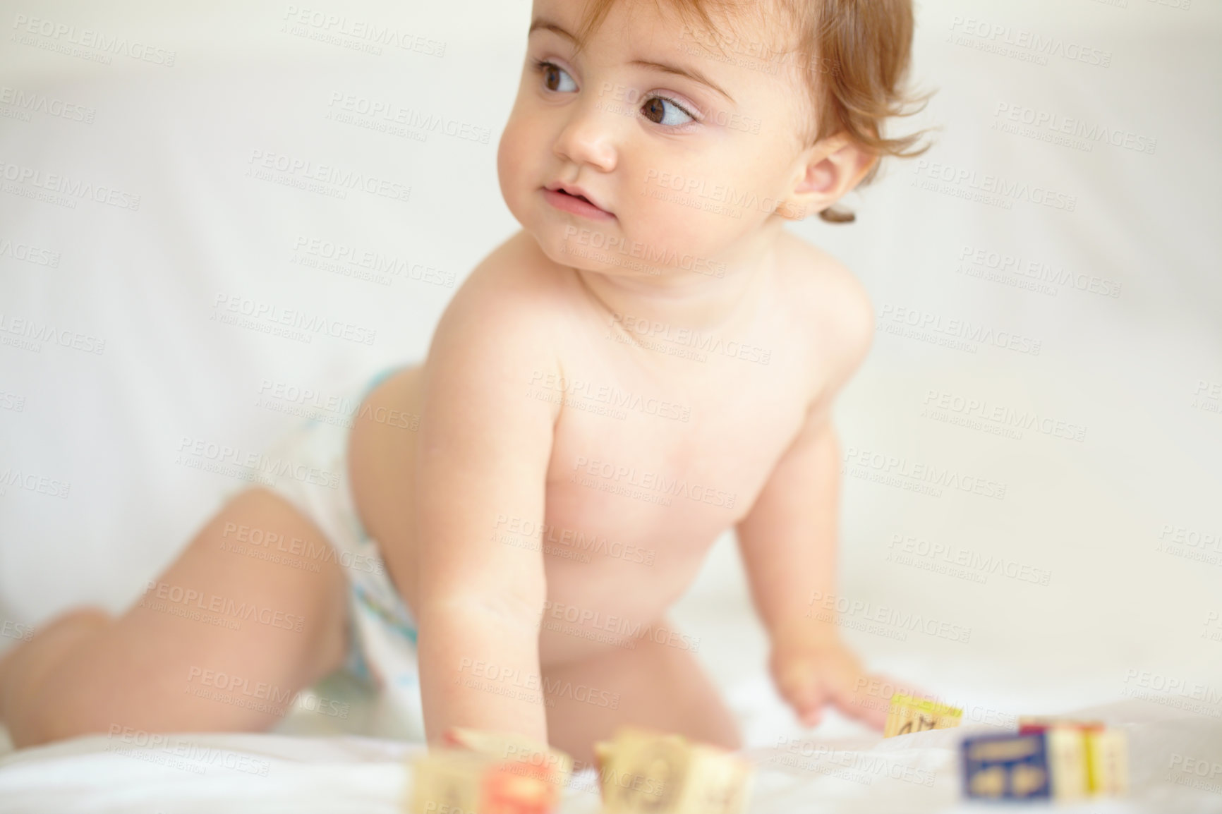 Buy stock photo Baby, building blocks and playing on bed, education and learning for child development in bedroom. Sensory, alphabet and english or letters, care and toys for growth, coordination and cognitive skill
