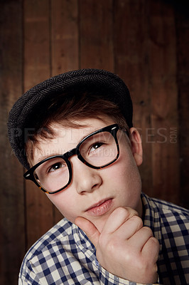 Buy stock photo Young boy in retro clothing wearing spectacles with a thoughtful expression