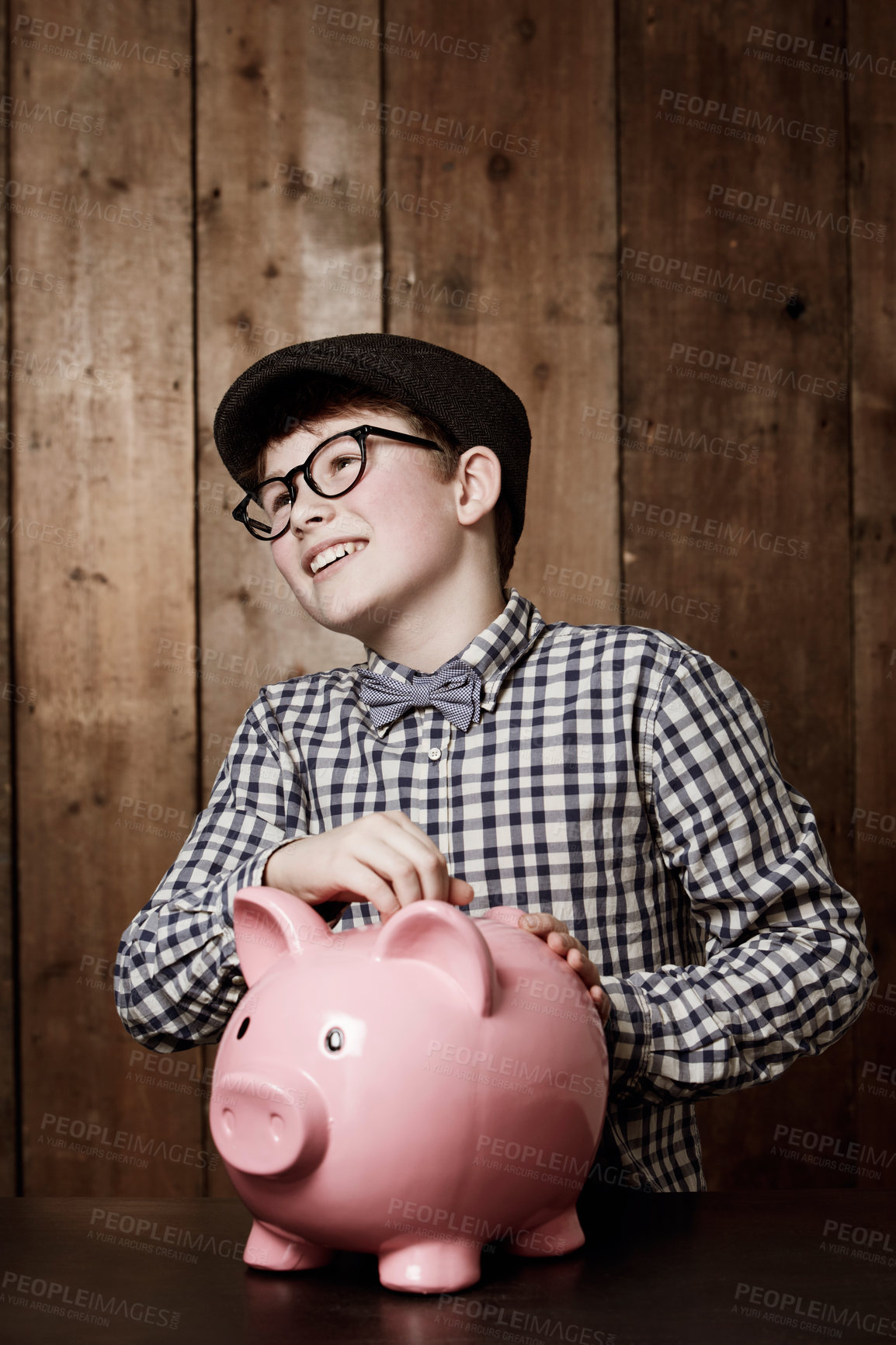 Buy stock photo Piggy bank, money and boy child with savings, growth or investment, planning or learning at home. Happy, budget and kid in a house with coin, container or cash box for future, financial and security