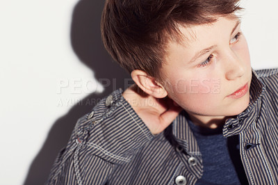 Buy stock photo Teenager, fashion and boy thinking in studio, white background or dream of future. Cool, style and child with ideas, creativity and confidence in trendy clothes, outfit and personality on backdrop
