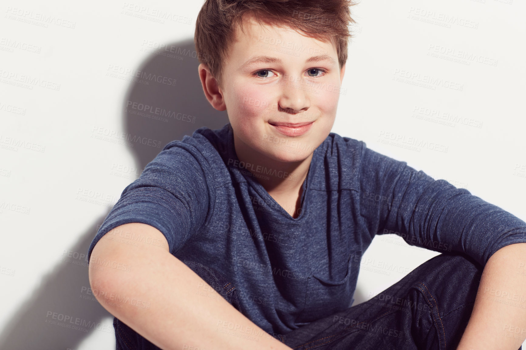 Buy stock photo Happy, teenager and portrait of boy with fashion sitting in white background of studio. Cool, style and kid with a smile, confidence and pride in trendy outfit or relax in clothes on backdrop