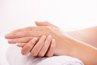 Buy stock photo Woman, hands and french manicure in salon, spa and cosmetic care, skincare and beauty. Natural growth, wellness and treatment for hygiene, closeup and nail parlour with towel, clean and maintenance