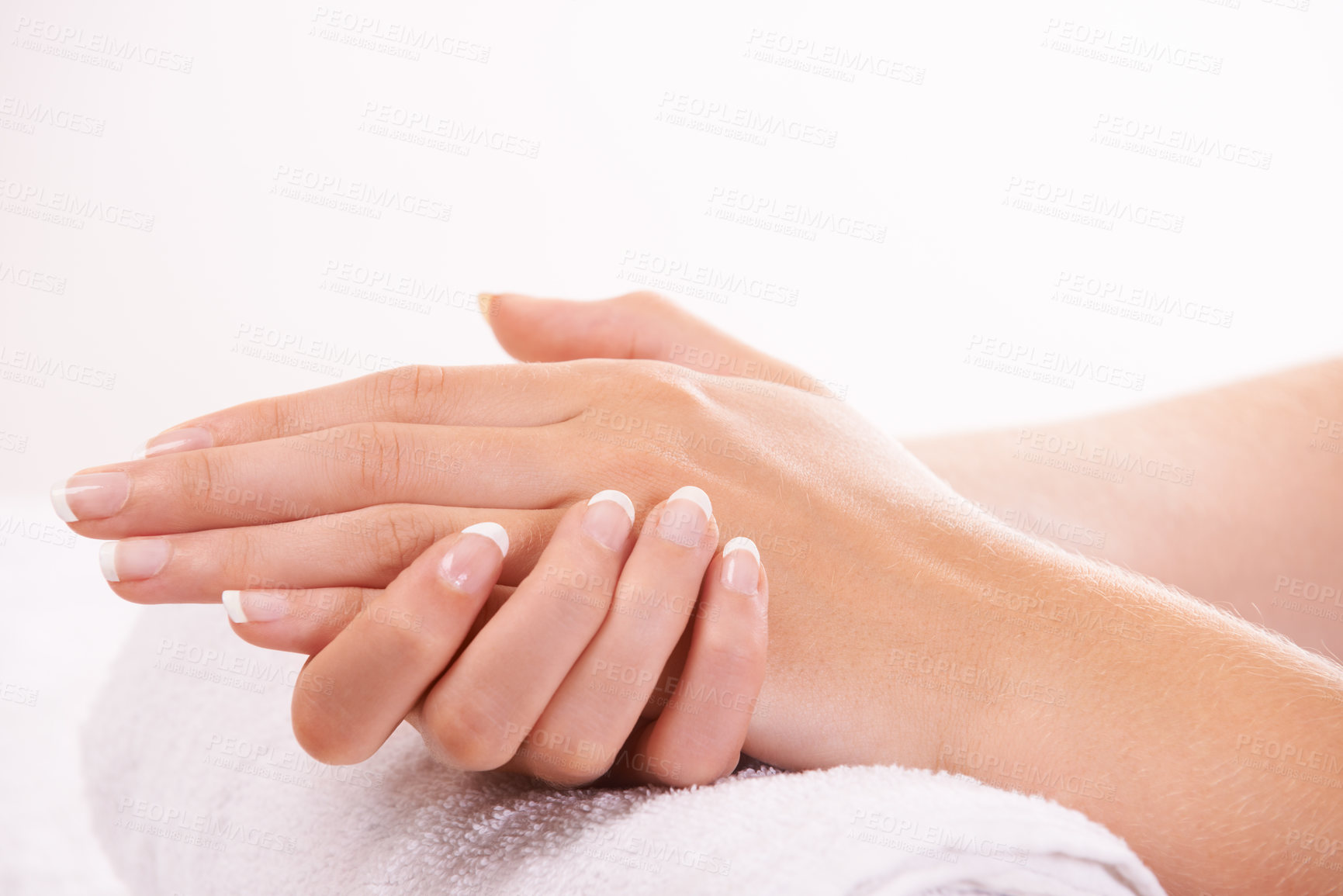 Buy stock photo Woman, hands and french manicure in salon, spa and cosmetic care, skincare and beauty. Natural growth, wellness and treatment for hygiene, closeup and nail parlour with towel, clean and maintenance