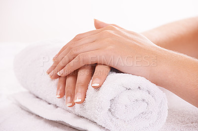 Buy stock photo Woman, hands and french manicure in salon, spa and cosmetic care, skincare and beauty. Natural growth, luxury and treatment for hygiene, closeup and nail parlour with towel, clean and maintenance