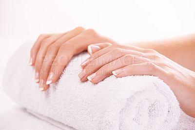 Buy stock photo Cropped shot of a woman's hands resting on a towel
