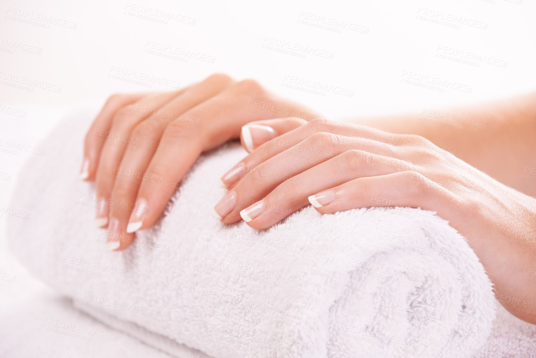 Buy stock photo Cropped shot of a woman's hands resting on a towel