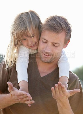Buy stock photo Happy, piggyback and father with kid in nature playing, having fun and bonding together. Smile, love and young dad carrying girl child from Canada holding hands for playful freedom with sky in a park