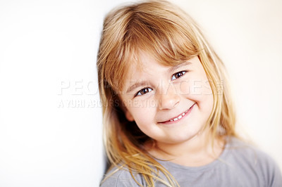 Buy stock photo A cute little blonde girl smiling at the camera - copyspace