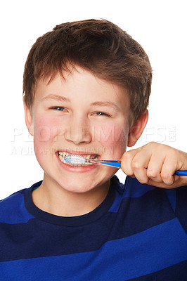 Buy stock photo Face, smile and kid brushing teeth in studio isolated on a white background. Portrait, boy and child with toothbrush for oral health, hygiene and dental wellness, fresh breath and cleaning gums.