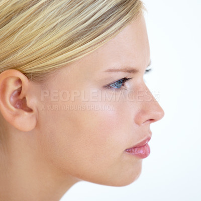 Buy stock photo Closeup of a young woman looking serious