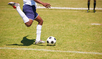 Buy stock photo Feet, soccer player and penalty kick on field for goal, competition or game for sports career. Man, football and shooting ball on grass pitch with accuracy for training, workout and contest outdoor