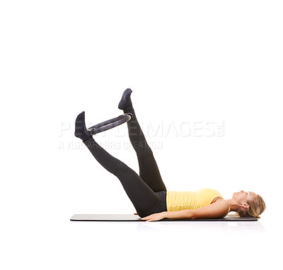 Buy stock photo Pilates ring, legs and woman exercise in studio isolated on a white background mockup space. Training, person on mat and magic circle for feet, balance and fitness for healthy body workout on floor