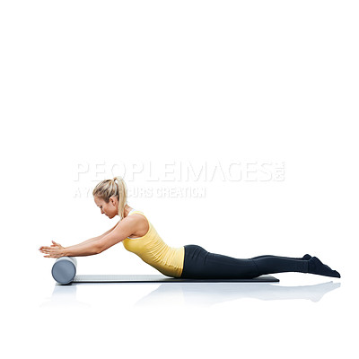 Buy stock photo Pilates, foam roller and woman in a studio for workout, stretching or gym routine with yoga mat. Stability, balance and young female athlete from Australia with body exercise by white background.