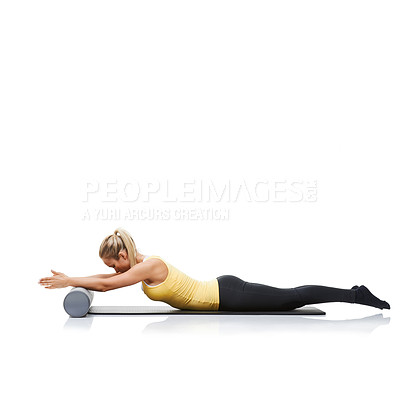 Buy stock photo Fitness, foam roller and woman in a studio for exercise, stretching or gym routine with yoga mat. Stability, balance and young female athlete from Australia with body workout by white background.