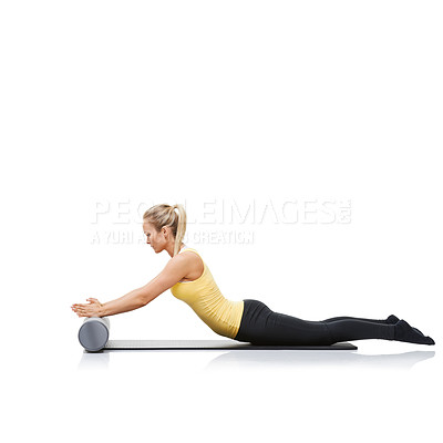 Buy stock photo Health, foam roller and woman in a studio for exercise, stretching or gym routine with yoga mat. Stability, balance and young female athlete from Australia with body workout by white background.