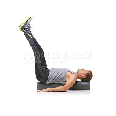 Buy stock photo Exercise, foam roller and man in pilates back workout, legs stretching or wellness for rehabilitation strength. Floor, mockup space and studio athlete fitness, balance or training on white background