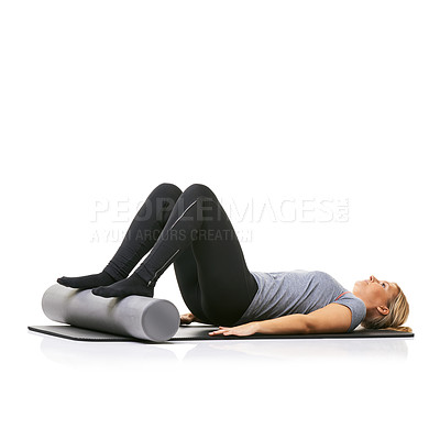 Buy stock photo Pilates, foam roller and woman in core workout, exercise or wellness for sports rehabilitation on floor. Ground, mockup space and studio athlete fitness, training and lying on mat on white background
