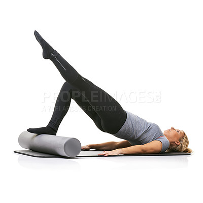 Buy stock photo Legs exercise, foam roller and studio woman with bridge workout, balance activity or wellness for gym pilates on floor. Fitness, body training and athlete core muscle development on white background