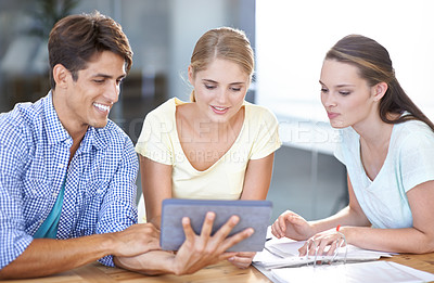 Buy stock photo Teamwork, tablet or designers with research in meeting for documents or paperwork together in office. Collaboration, employees reading or happy people watching videos online with smile in startup