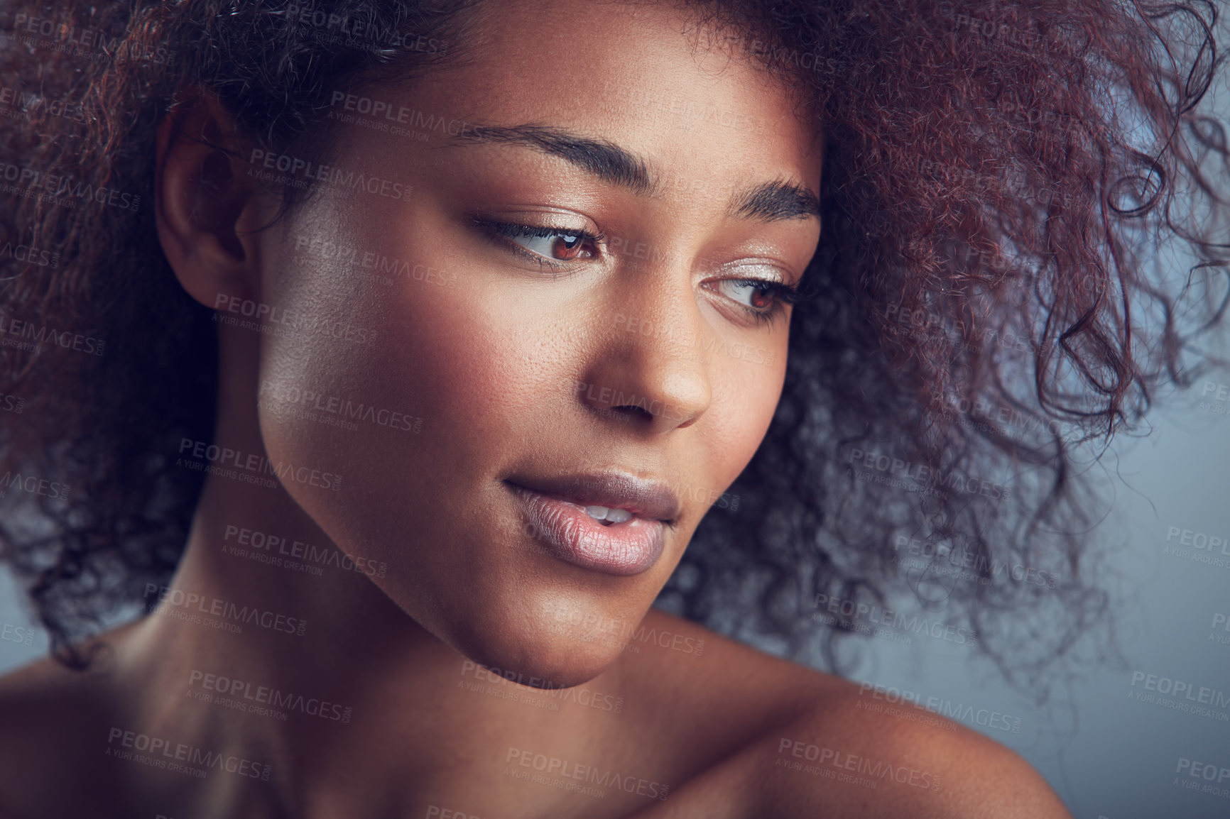Buy stock photo African woman, curly hair and thinking in studio with makeup, cosmetics and vision by background. Girl, model and wellness with skincare, natural aesthetic and glow on face with beauty by backdrop