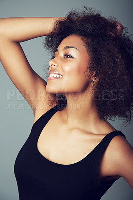 Buy stock photo Woman, afro and hair care for natural beauty in studio or curly treatment, grey background or mockup space. Female person, smile and grooming confidence or healthy wellness, texture pride or volume