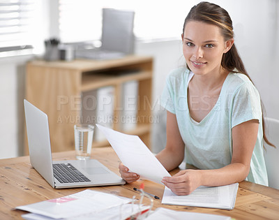Buy stock photo Business woman, laptop and documents for planning, research and copywriting paperwork in office portrait. Young writer, editor or creative worker on her computer and editing article or job newsletter