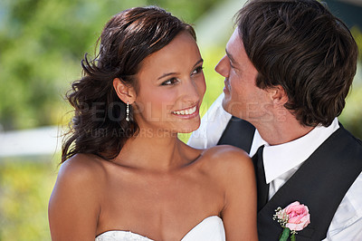 Buy stock photo A bride and groom looking lovingly into each other's eyes