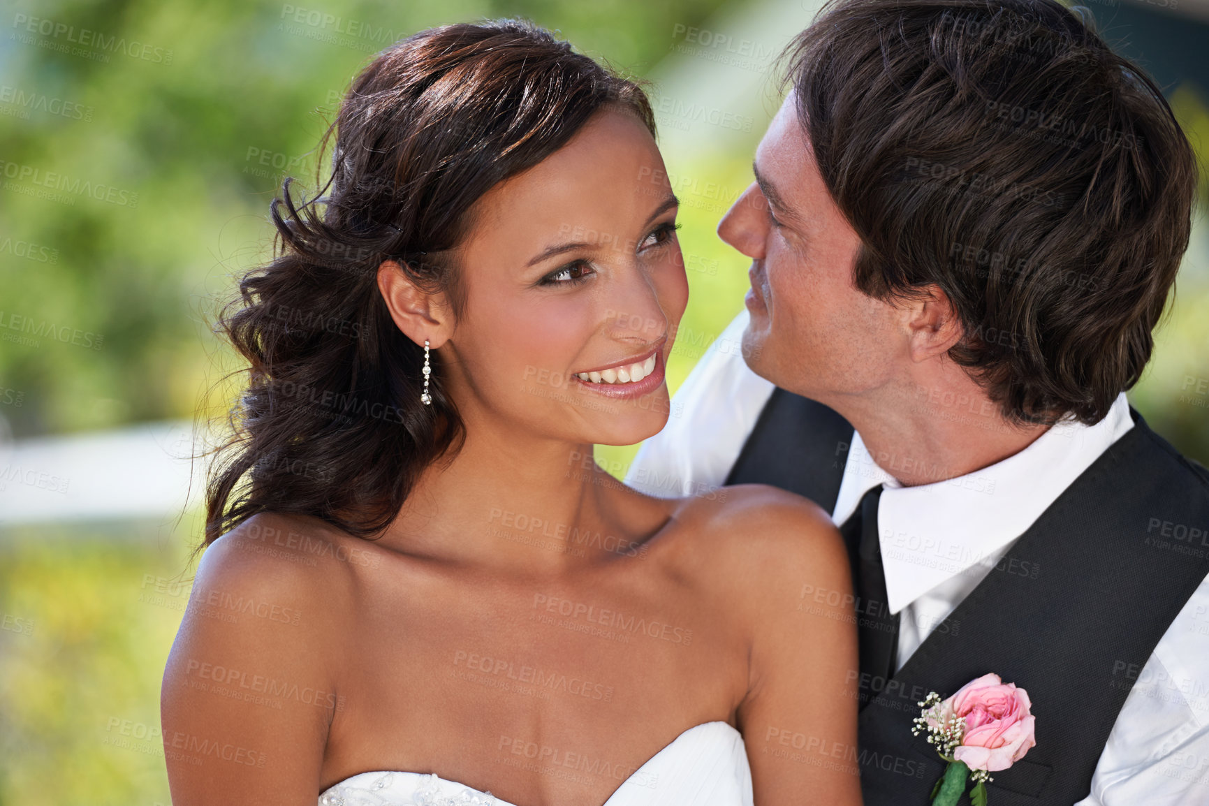 Buy stock photo A bride and groom looking lovingly into each other's eyes