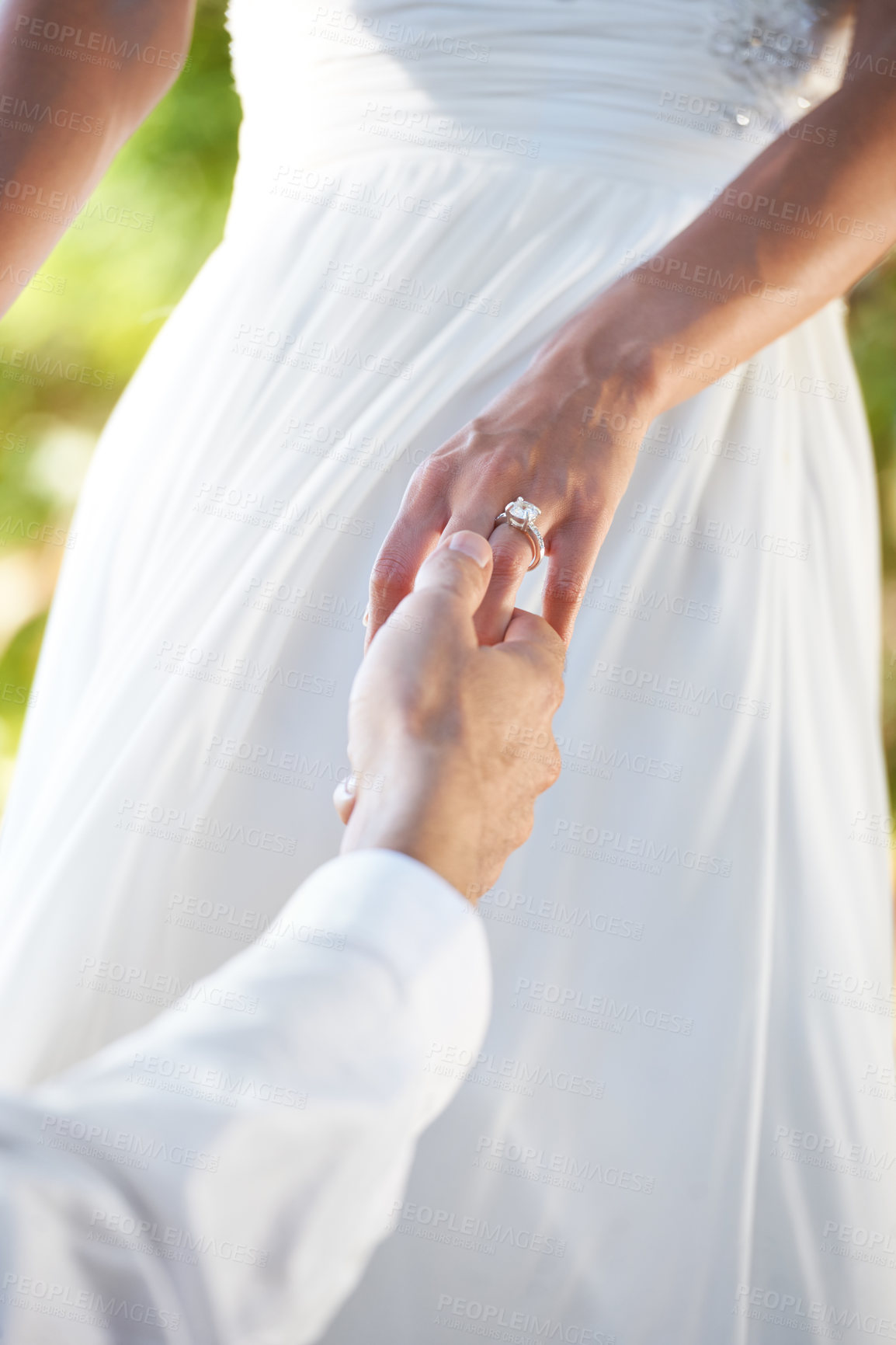 Buy stock photo Cropped image of a groom taking his bride's hand