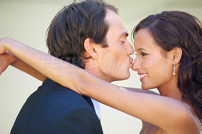 Buy stock photo Couple, kissing nose and wedding day with happiness, ceremony and commitment for husband and wife. Love, trust and celebration for marriage, smile and young for romantic union, married and hug
