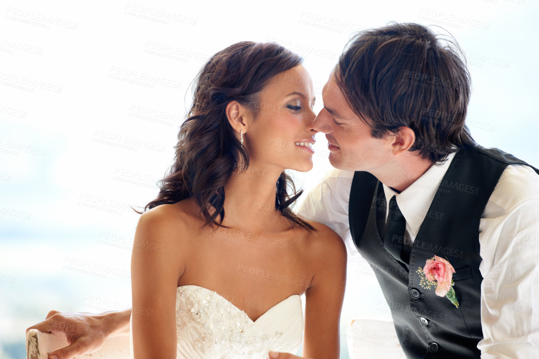 Buy stock photo A happy newlywed couple kissing