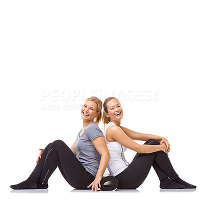Buy stock photo Two gym friends sitting back to back while isolated on a white background