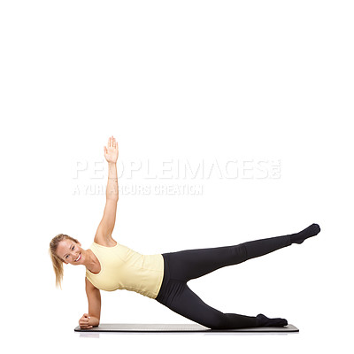Buy stock photo Woman, yoga and mat in studio for side plank, fitness or workout for healthy body, happy or core muscle. Person, portrait and pilates on floor for abdomen health on mockup space or white background