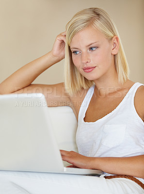 Buy stock photo Young woman, laptop and relax on sofa with online streaming service for website, movie or social media. Person watch or reading on her computer for internet search and subscription on a couch at home