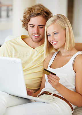 Buy stock photo Young couple, credit card and laptop for home online shopping, loan and digital money on a sofa. Happy woman and man on computer for internet banking, easy website payment or e commerce registration
