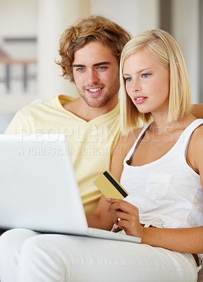 Buy stock photo Couple, credit card and laptop for online shopping, loan registration or digital money on sofa at home. Young woman and man relax on computer for internet banking, website payment or e commerce order
