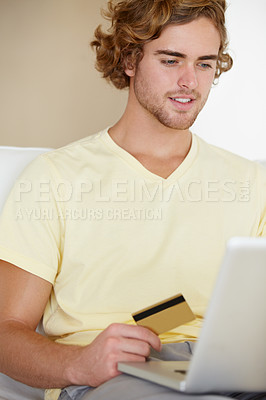 Buy stock photo Young man, credit card and laptop for online shopping, fintech payment and digital money in trading or stock market. Online user, trader or person on his computer for internet banking or cash on sofa