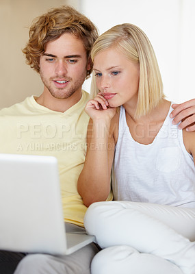Buy stock photo Laptop, love and couple relax in a house streaming movies, video or film, show or social media together. Tech, search and people in a living room with online entertainment for weekend or vacation