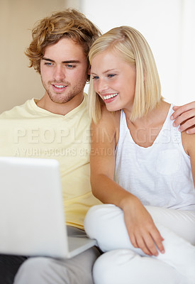 Buy stock photo Laptop, love and happy couple relax in a house streaming movies, video or film, show or social media together. Tech, search and people in living room with online entertainment for weekend or vacation