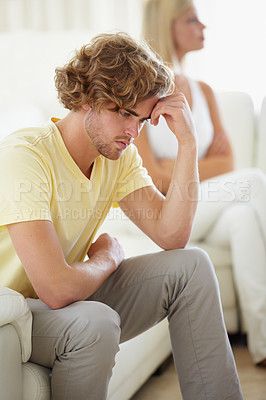 Buy stock photo Couple conflict, stress and divorce fight on a sofa with argument, anxiety or cheating depression in their home. Marriage crisis, dispute and overthinking man ignore woman narcissist in a living room