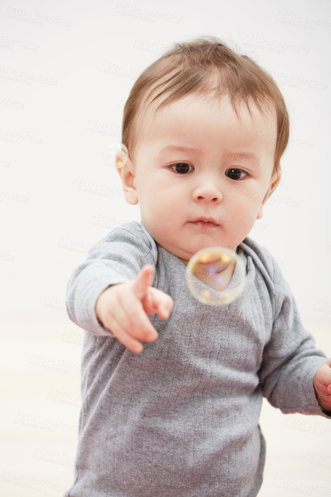 Buy stock photo Baby, bubbles and playing game for fun childhood development, curious wondering or education. Kid, growth and mockup space for learning progress or sensory, coordination skill or youth entertainment