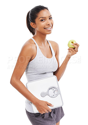 Buy stock photo Woman, portrait and apple with scale in diet, lose weight or body goals and progress in studio. Happy model or african person and green fruit, healthy food or nutrition benefits on a white background