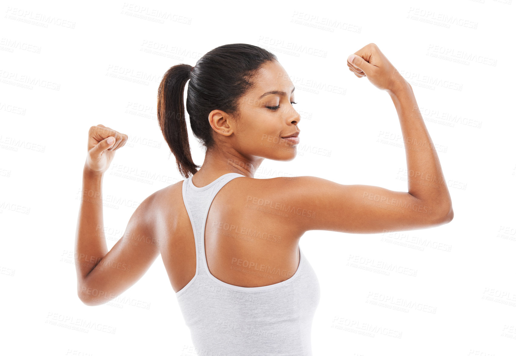 Buy stock photo A young woman in gym clothes flexing her arms