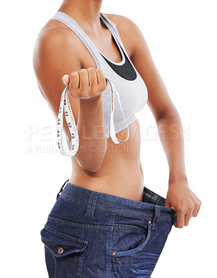 Buy stock photo Woman, hands and measuring tape in weight loss or diet against a white studio background. Closeup of slim female person or model measure pants size, waist or health and wellness from fitness exercise