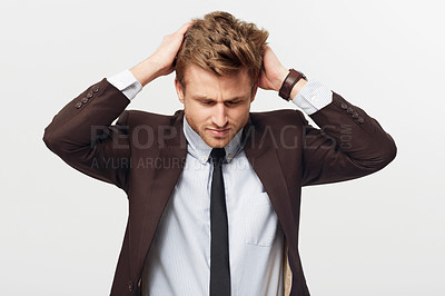 Buy stock photo Stress, burnout and mistake with a business man in studio isolated on a white background for error. Anxiety, fail and frustration with a young employee looking worried in a suit for corporate work