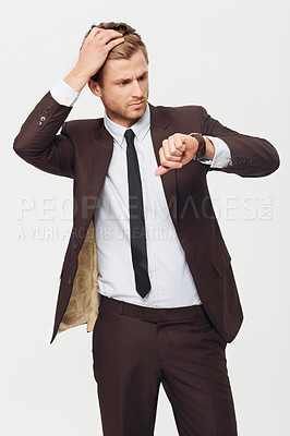 Buy stock photo Businessman, watch and checking time in late, stress or schedule deadline against a white studio background. Attractive young man looking at wristwatch in suit for mistake, business or fashion style