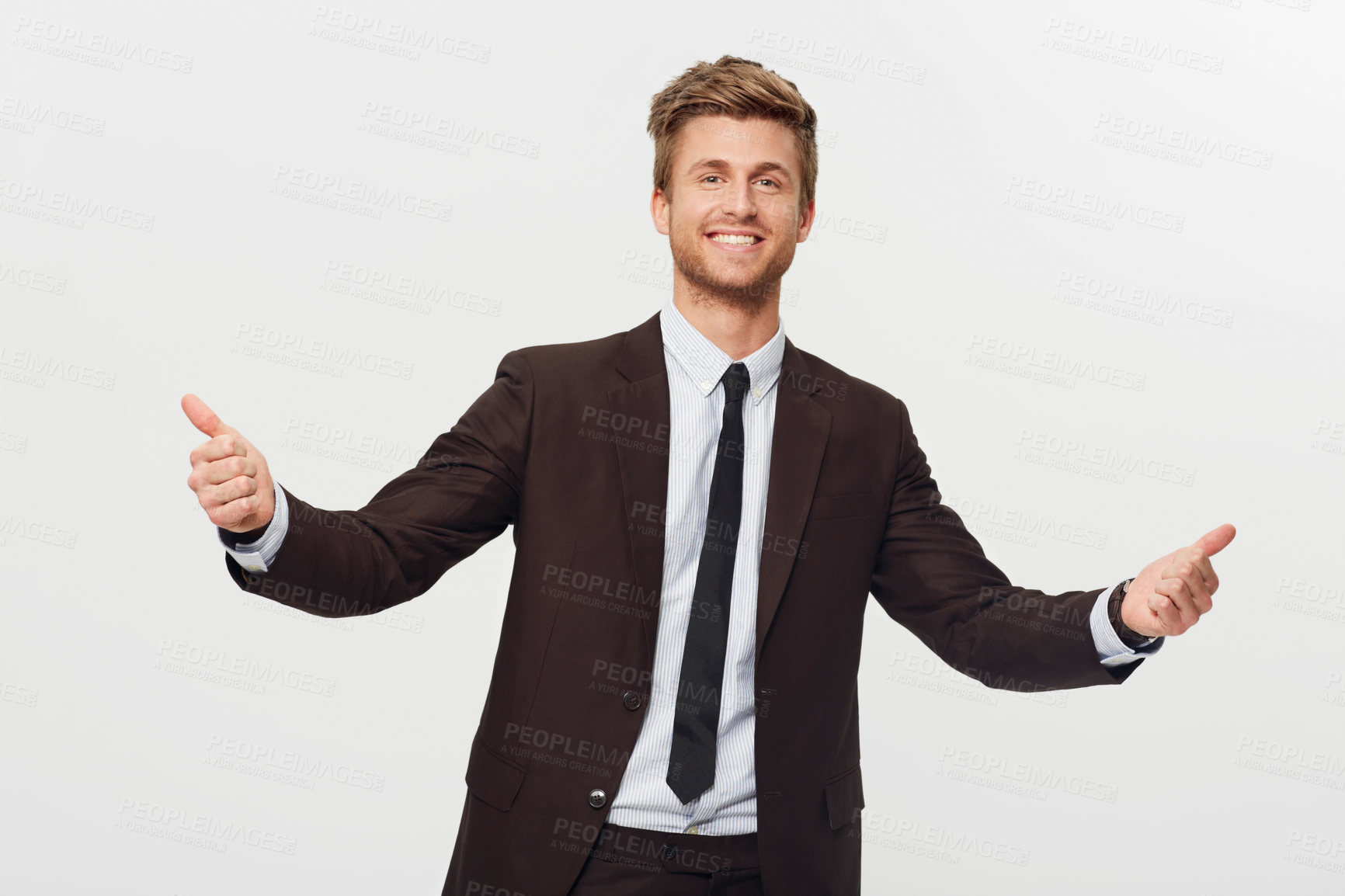 Buy stock photo Portrait, thumbs up and celebration with a business man in studio isolated on a white background for success. Smile, target or goals and a confident young employee in a suit for an emoji hand gesture